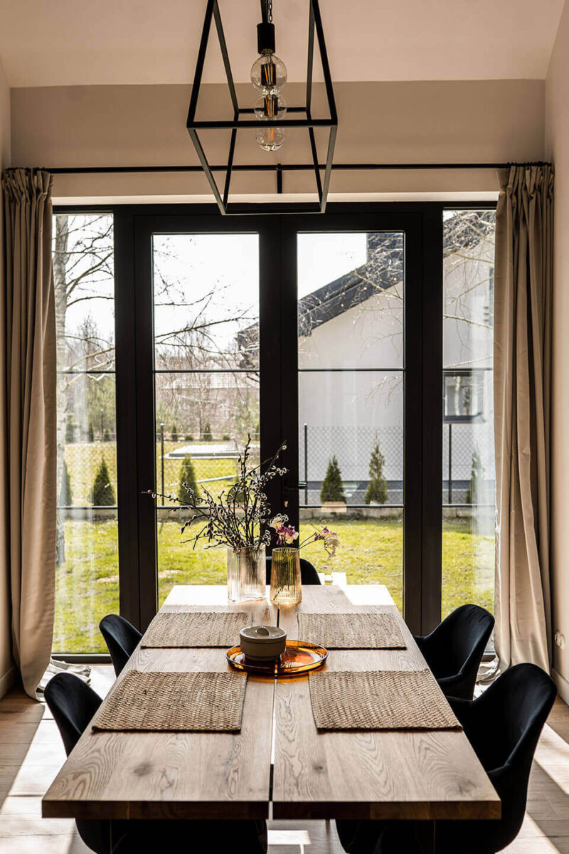 Black windows in the dining room.